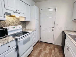 Charming 2 bedroom 1-bathroom Duplex unit features a prime location