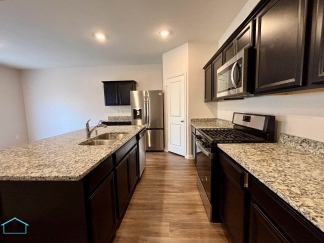 Stunning two-story residence featuring 4 spacious bedrooms and 3 well-appointed bathrooms!