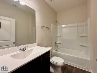 Stunning two-story residence featuring 4 spacious bedrooms and 3 well-appointed bathrooms!