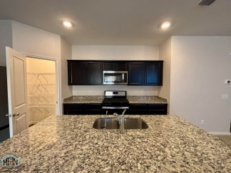 Stunning two-story residence featuring 4 spacious bedrooms and 3 well-appointed bathrooms!