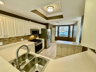 Spacious, first-floor, end-unit condominium for rent in luxurious Heritage Oaks. 2bed, 2bath, den, garage.