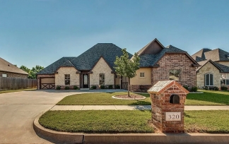 NOW SHOWING! Fall Special $500 Off the First Month's Rent! Custom Yukon Home with Indoor & Outdoor Fireplaces + Bonus Room!-AVAILABLE NOW!