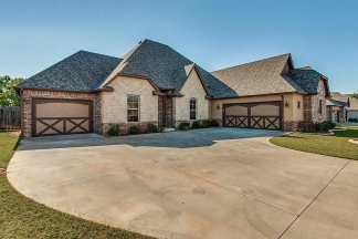 NOW SHOWING! Fall Special $500 Off the First Month's Rent! Custom Yukon Home with Indoor & Outdoor Fireplaces + Bonus Room!-AVAILABLE NOW!