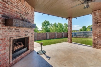 NOW SHOWING! Fall Special $500 Off the First Month's Rent! Custom Yukon Home with Indoor & Outdoor Fireplaces + Bonus Room!-AVAILABLE NOW!