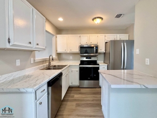 Modern Comfort meets Serene Living - A Stunning 4-bedroom, 2-bath Residential Oasis!