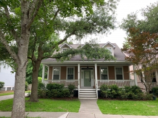 Charming two story home on a tree lined street.