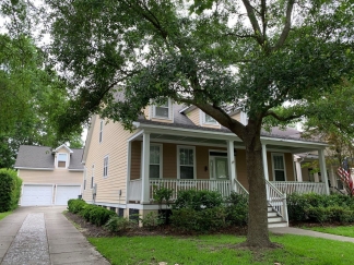 Charming two story home on a tree lined street.