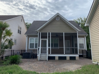 Charming two story home on a tree lined street.