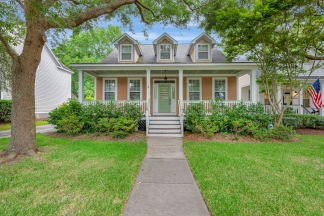 Charming two story home on a tree lined street.
