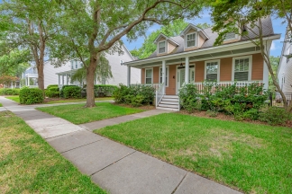 Charming two story home on a tree lined street.