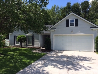 Great house with a corner fireplace that can be viewed from the kitchen and the family room.