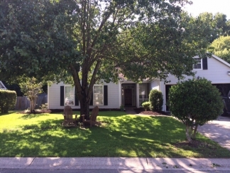 Great house with a corner fireplace that can be viewed from the kitchen and the family room.