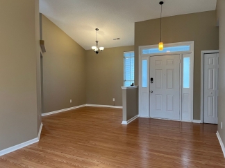 Great house with a corner fireplace that can be viewed from the kitchen and the family room.