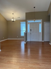 Great house with a corner fireplace that can be viewed from the kitchen and the family room.