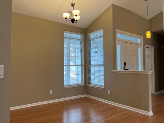 Great house with a corner fireplace that can be viewed from the kitchen and the family room.