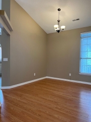 Great house with a corner fireplace that can be viewed from the kitchen and the family room.