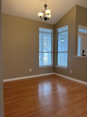Great house with a corner fireplace that can be viewed from the kitchen and the family room.