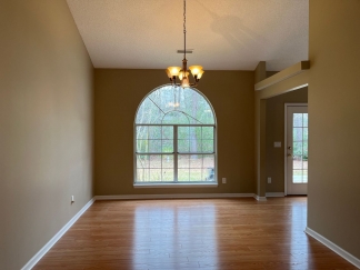 Great house with a corner fireplace that can be viewed from the kitchen and the family room.