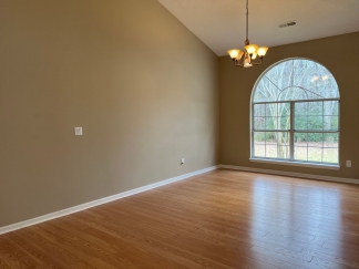 Great house with a corner fireplace that can be viewed from the kitchen and the family room.