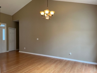 Great house with a corner fireplace that can be viewed from the kitchen and the family room.