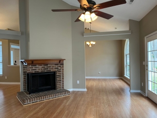 Great house with a corner fireplace that can be viewed from the kitchen and the family room.