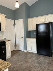 Great house with a corner fireplace that can be viewed from the kitchen and the family room.