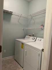 Great house with a corner fireplace that can be viewed from the kitchen and the family room.