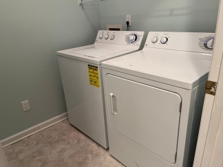 Great house with a corner fireplace that can be viewed from the kitchen and the family room.