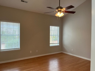 Great house with a corner fireplace that can be viewed from the kitchen and the family room.