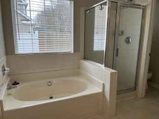 Great house with a corner fireplace that can be viewed from the kitchen and the family room.