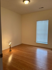 Great house with a corner fireplace that can be viewed from the kitchen and the family room.