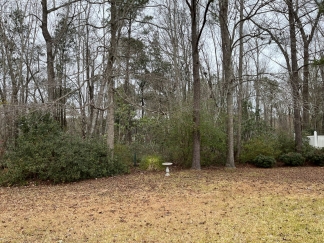 Great house with a corner fireplace that can be viewed from the kitchen and the family room.