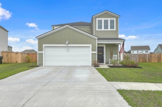 Like-New Pond Lot Home with First-Floor Primary Suite