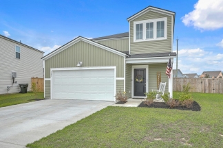 Like-New Pond Lot Home with First-Floor Primary Suite