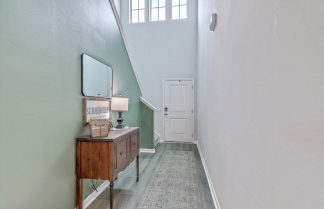 Like-New Pond Lot Home with First-Floor Primary Suite