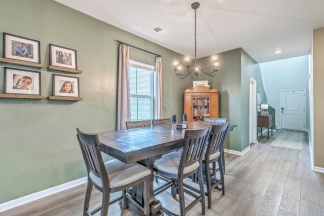 Like-New Pond Lot Home with First-Floor Primary Suite