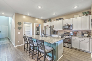 Like-New Pond Lot Home with First-Floor Primary Suite