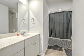 Like-New Pond Lot Home with First-Floor Primary Suite