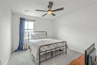 Like-New Pond Lot Home with First-Floor Primary Suite