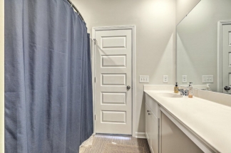 Like-New Pond Lot Home with First-Floor Primary Suite