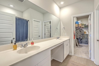 Like-New Pond Lot Home with First-Floor Primary Suite