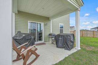 Like-New Pond Lot Home with First-Floor Primary Suite