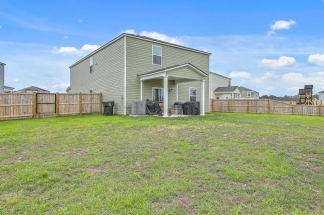 Like-New Pond Lot Home with First-Floor Primary Suite