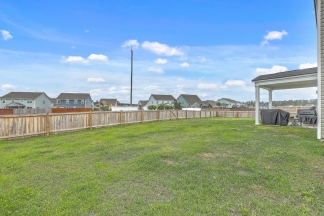 Like-New Pond Lot Home with First-Floor Primary Suite