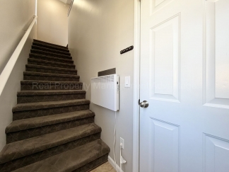 Rare Corner Upper Condo with Vaulted Ceilings, Private Balcony and 2 Car Garage - Right Across from the GM Tech Center!