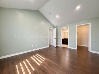 Rare Corner Upper Condo with Vaulted Ceilings, Private Balcony and 2 Car Garage - Right Across from the GM Tech Center!