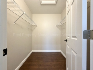 Rare Corner Upper Condo with Vaulted Ceilings, Private Balcony and 2 Car Garage - Right Across from the GM Tech Center!