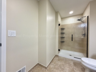 Rare Corner Upper Condo with Vaulted Ceilings, Private Balcony and 2 Car Garage - Right Across from the GM Tech Center!