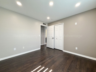 Rare Corner Upper Condo with Vaulted Ceilings, Private Balcony and 2 Car Garage - Right Across from the GM Tech Center!