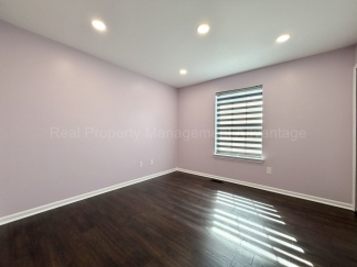 Rare Corner Upper Condo with Vaulted Ceilings, Private Balcony and 2 Car Garage - Right Across from the GM Tech Center!
